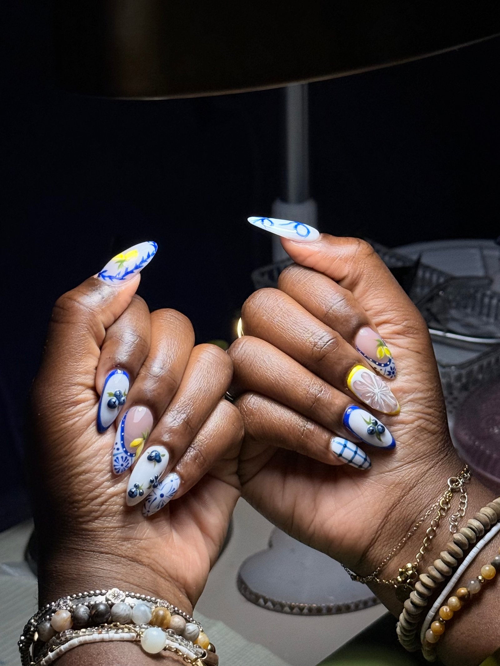 Blueberry and lemon hand-painted nails by Purebeyoutybar